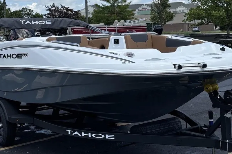Slide: The Image of 2026 Tahoe 1950 boat on trailer, sleek design, white and gray exterior. - 1