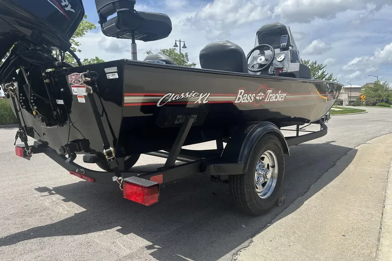 Slide: The Image of 2026 Tracker Bass Tracker Classic XL boat on trailer, parked on street. - 5