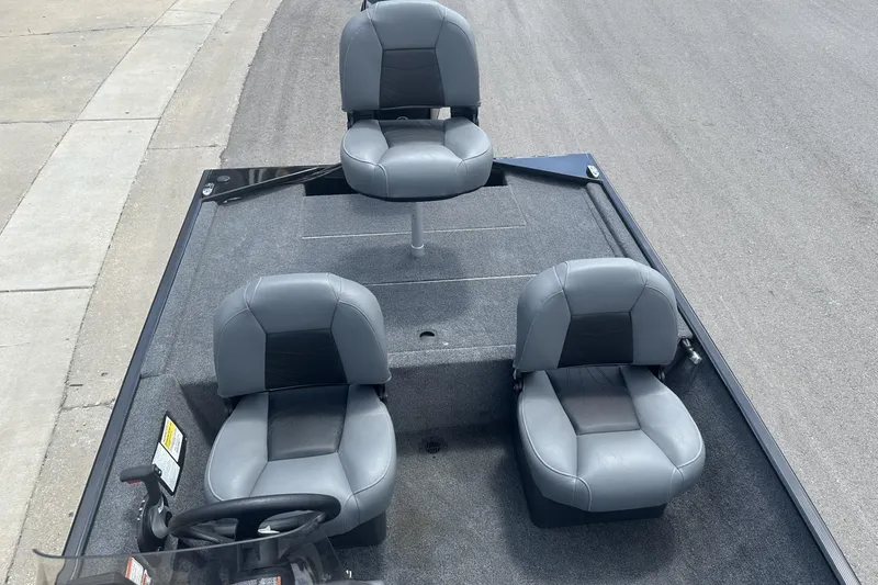 Slide: The Image of 2026 Tracker Bass Tracker Classic XL boat interior with three gray seats. - 8