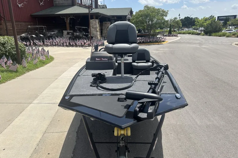 Slide: The Image of 2026 Tracker Bass Tracker Classic XL boat parked on a sunny street. - 6