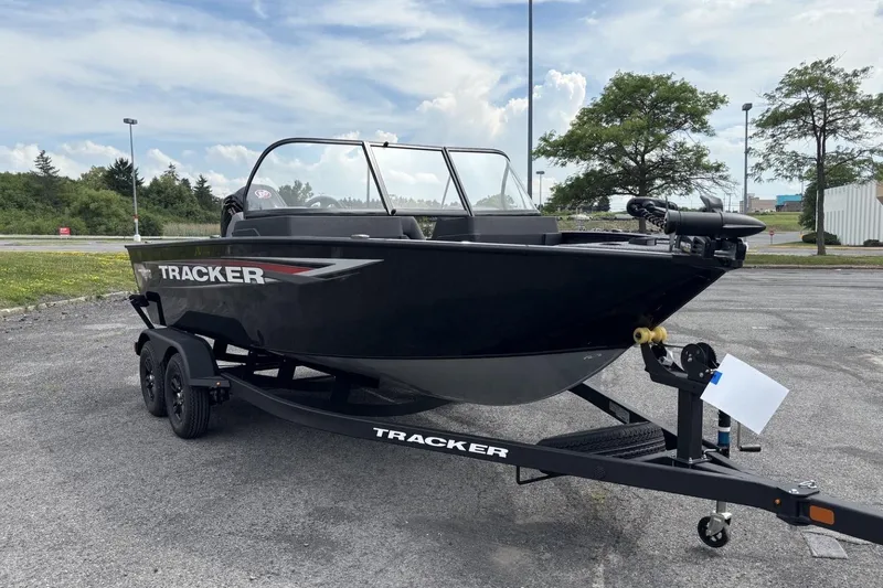 Slide: The Image of 2026 Tracker Pro Guide V-175 WT boat on trailer, parked outdoors. - 4