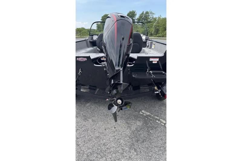 Slide: The Image of 2026 Tracker Pro Guide V-175 WT boat with outboard motor on trailer. - 3