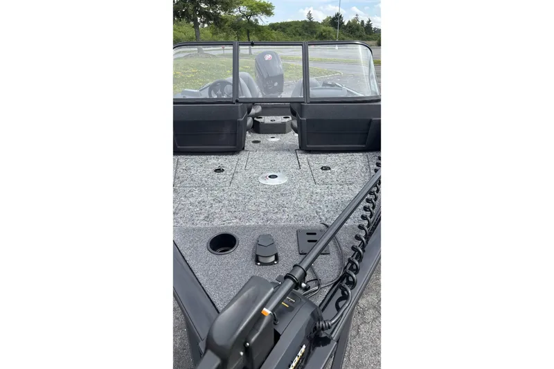 Slide: The Image of 2026 Tracker Pro Guide V-175 WT boat interior with windshield and fishing deck. - 2