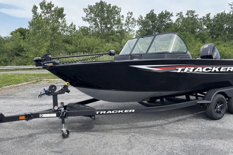 The Image of 2026 Tracker Pro Guide V-175 WT boat on trailer, parked outdoors. - 0