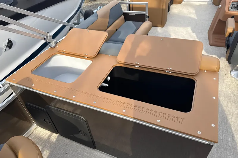 Slide: The Image of 2026 Tahoe Pontoon Sport 85 Rear Fish with open storage compartments and seating area. - 4
