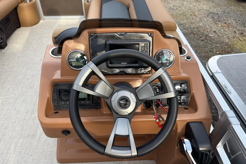 Slide: The Image of 2026 Tahoe Pontoon Sport 85 Rear Fish dashboard with steering wheel and controls. - 6