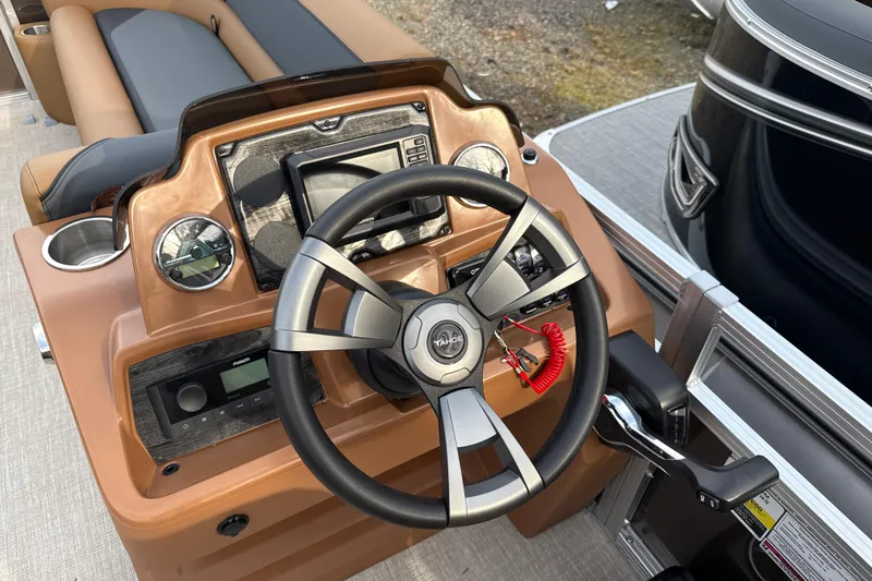 Slide: The Image of Steering console of 2026 Tahoe Pontoon Sport 85 Rear Fish with modern controls. - 7