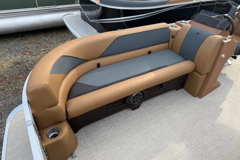 Slide: The Image of 2026 Tahoe Pontoon Sport 85 Rear Fish boat seating, featuring tan and gray upholstery. - 9