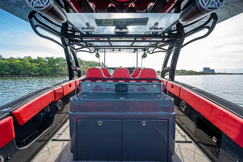 Slide: The Image of 2021 Midnight Express 43 Solstice boat interior with red seating and sleek design. - 10