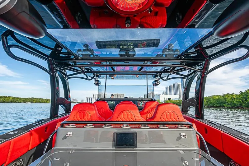 Slide: The Image of Luxurious 2021 Midnight Express 43 Solstice boat interior with vibrant red seating and sleek design. - 11