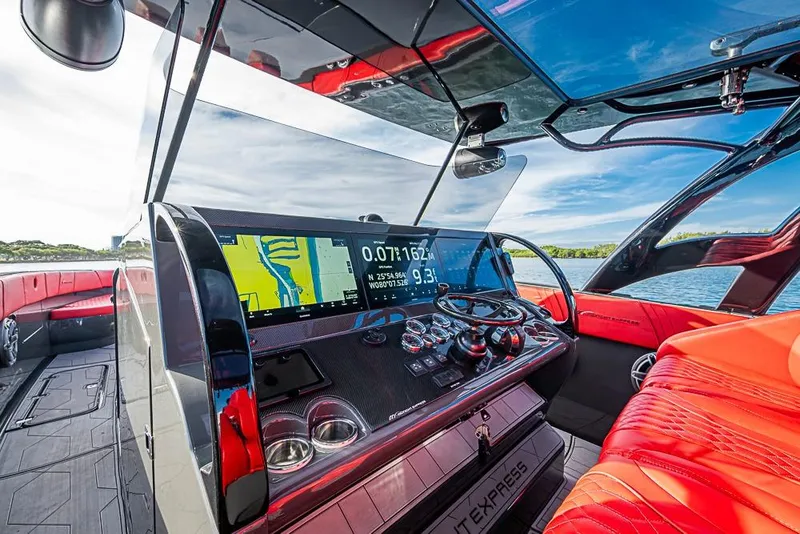 Slide: The Image of Cockpit of 2021 Midnight Express 43 Solstice boat with advanced navigation system. - 22