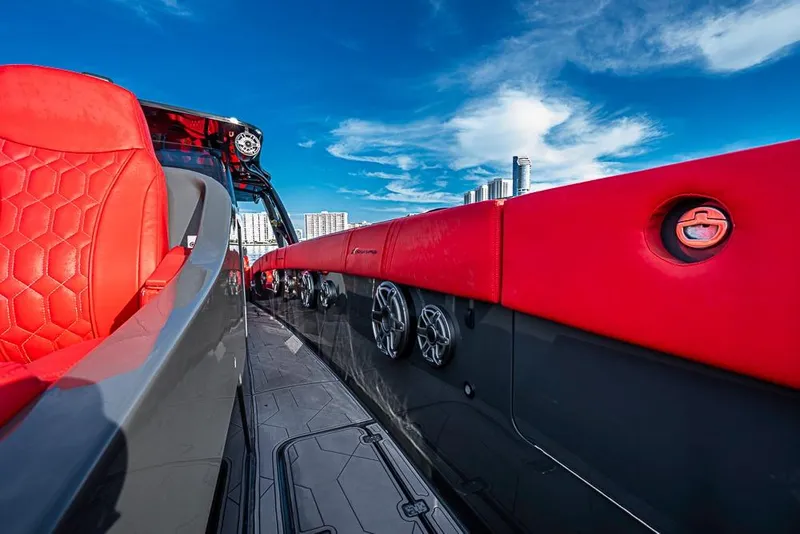 Slide: The Image of Luxurious 2021 Midnight Express 43 Solstice boat with red seating and sleek design. - 34