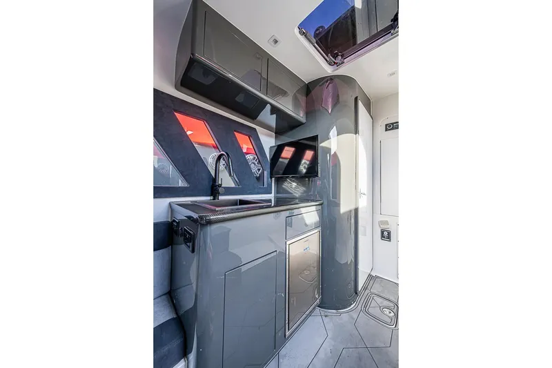 Slide: The Image of Modern interior of 2021 Midnight Express 43 Solstice boat with sleek cabinetry and appliances. - 35