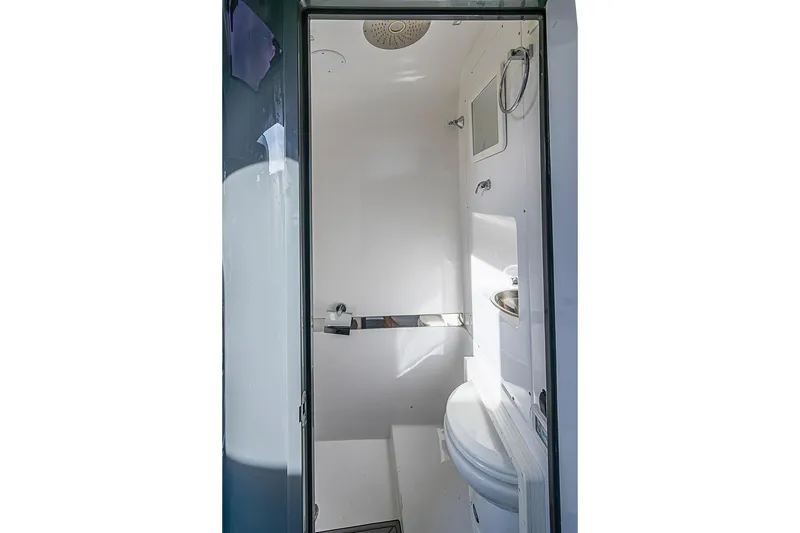 Slide: The Image of Compact bathroom interior of 2021 Midnight Express 43 Solstice boat, featuring modern fixtures. - 37