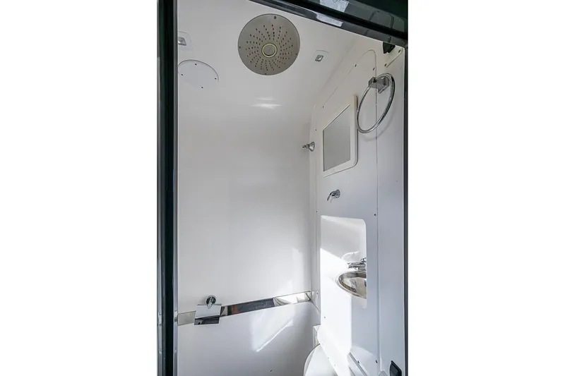 Slide: The Image of 2021 Midnight Express 43 Solstice boat bathroom interior with shower and sink. - 38