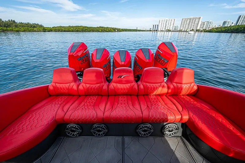 Slide: The Image of Red leather seating on 2021 Midnight Express 43 Solstice boat with powerful outboard engines. - 4