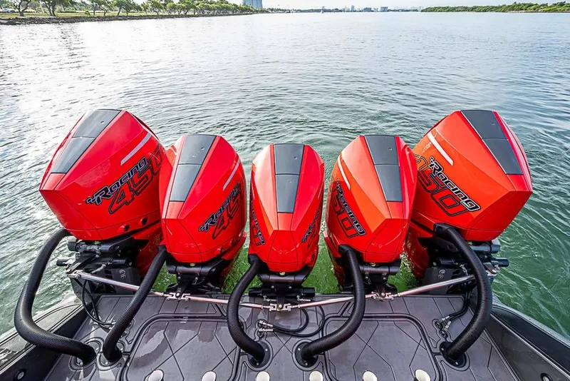 Slide: The Image of Four powerful outboard engines on a 2021 Midnight Express 43 Solstice boat. - 41