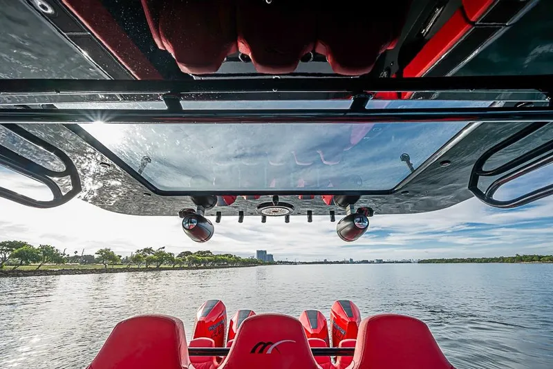 Slide: The Image of Interior view of 2021 Midnight Express 43 Solstice boat, overlooking calm waters and distant skyline. - 43