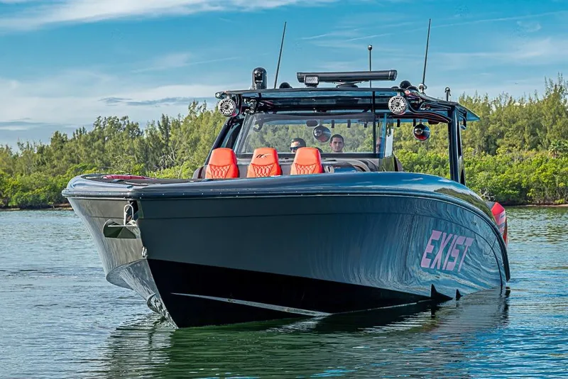 Slide: The Image of 2021 Midnight Express 43 Solstice boat on water, featuring sleek design and vibrant seating. - 44