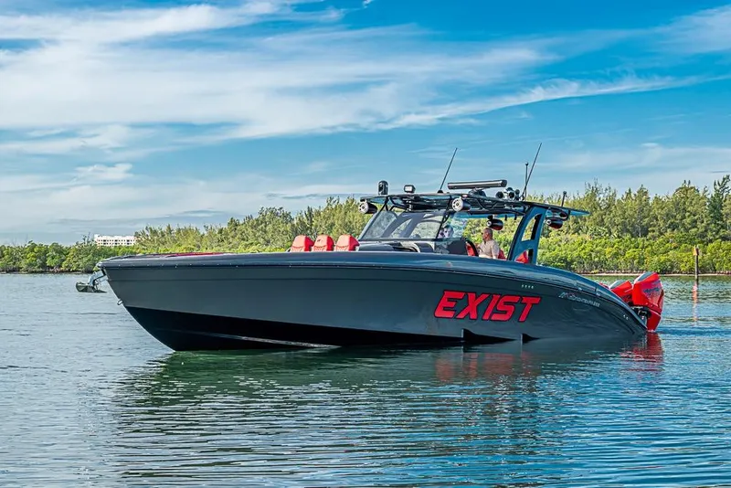Slide: The Image of 2021 Midnight Express 43 Solstice boat on calm water, featuring sleek design and vibrant graphics. - 45