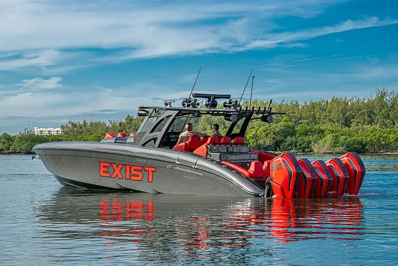 Slide: The Image of 2021 Midnight Express 43 Solstice boat with multiple engines on calm water. - 47