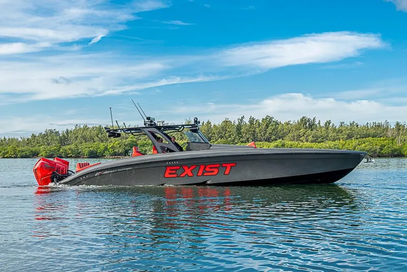 Slide: The Image of 2021 Midnight Express 43 Solstice boat on water, featuring bold "EXIST" branding. - 51