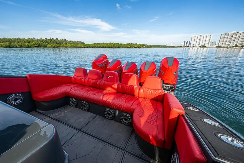 Slide: The Image of Red seating and powerful engines on a 2021 Midnight Express 43 Solstice boat. - 6