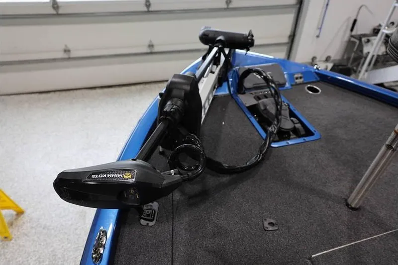 Slide: The Image of 2026 Vexus AVX 2085S boat with Minn Kota trolling motor on deck. - 14