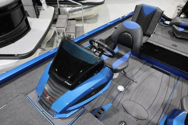 Slide: The Image of 2026 Vexus AVX 2085S boat interior with blue and black seating and steering console. - 17