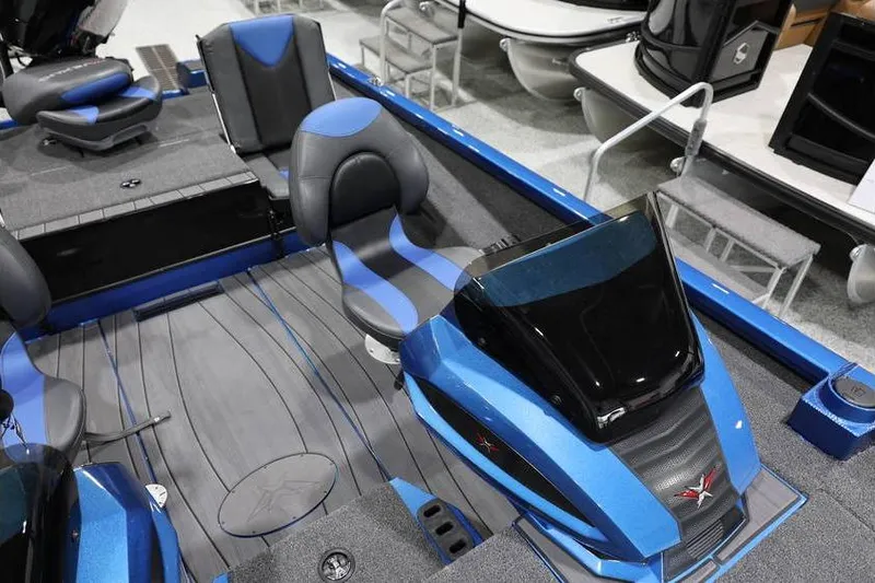 Slide: The Image of 2026 Vexus AVX 2085S boat interior with blue and gray seating and sleek design. - 18
