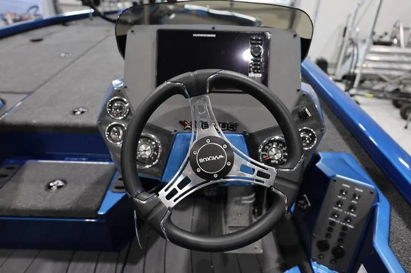 Slide: The Image of Steering console of 2026 Vexus AVX 2085S boat with modern controls and dashboard. - 21