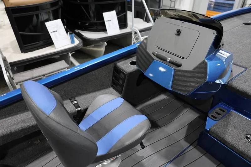 Slide: The Image of 2026 Vexus AVX 2085S boat interior with blue and black seating and dashboard. - 23