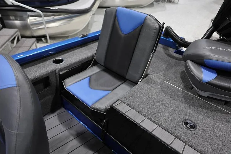 Slide: The Image of 2026 Vexus AVX 2085S boat interior with blue and gray seating. - 27