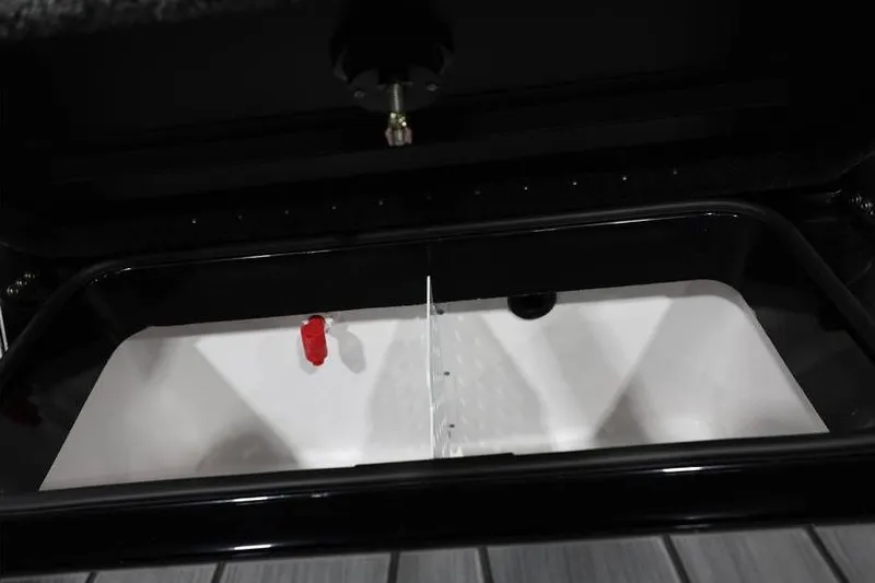 Slide: The Image of 2026 Vexus AVX 2085S boat compartment with divider and red valve. - 29