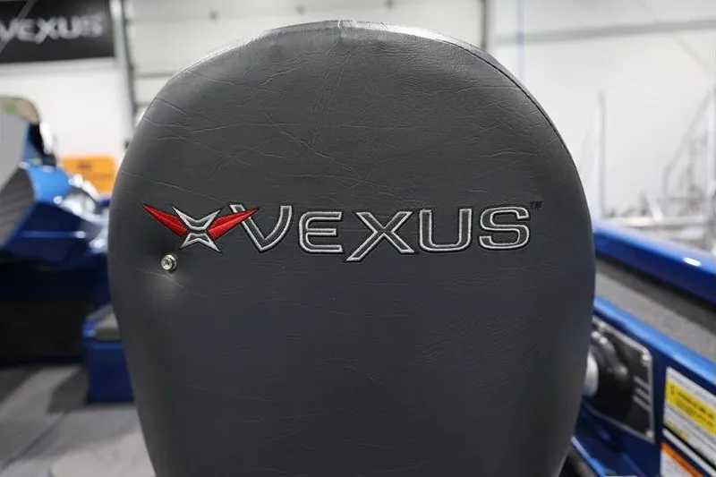 Slide: The Image of 2026 Vexus AVX 2085S boat seat with logo in a showroom setting. - 31