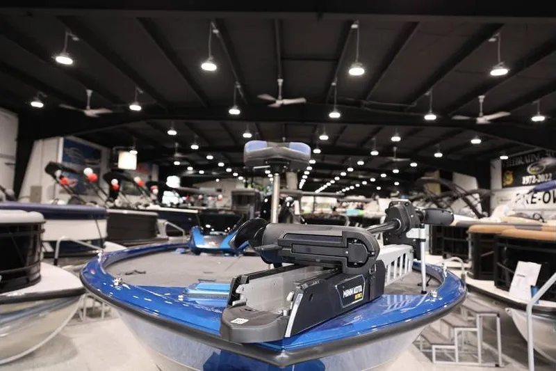 Slide: The Image of 2026 Vexus AVX 2085S boat displayed in a showroom with modern lighting. - 9