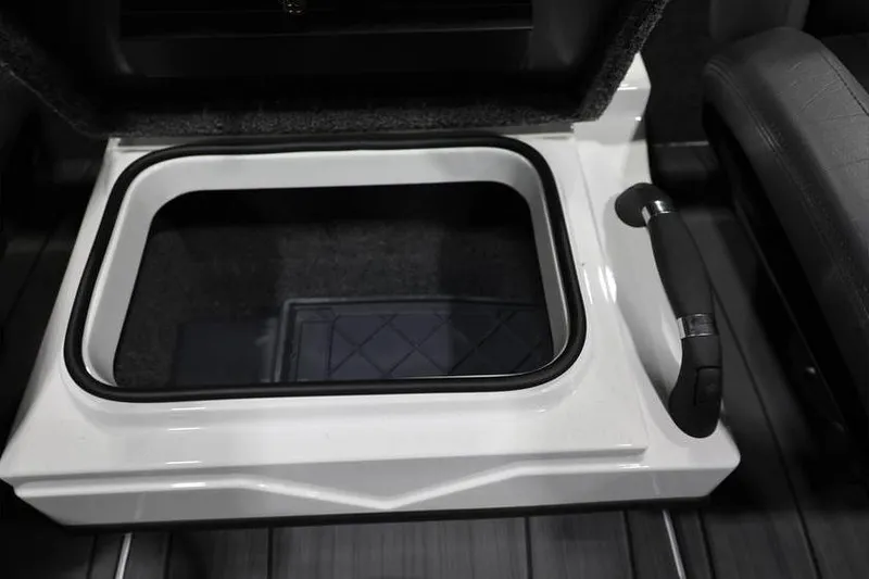 Slide: The Image of 2026 Vexus AVX 2100 boat storage compartment with handle, featuring sleek design. - 15