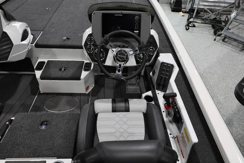 Slide: The Image of Interior of 2026 Vexus AVX 2100 boat featuring modern steering console and seating. - 16