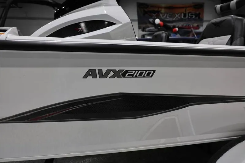 Slide: The Image of 2026 Vexus AVX 2100 boat side view with logo and sleek design. - 18