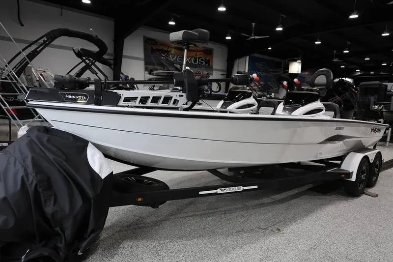 Slide: The Image of 2026 Vexus AVX 2100 boat displayed indoors on a trailer. - 3