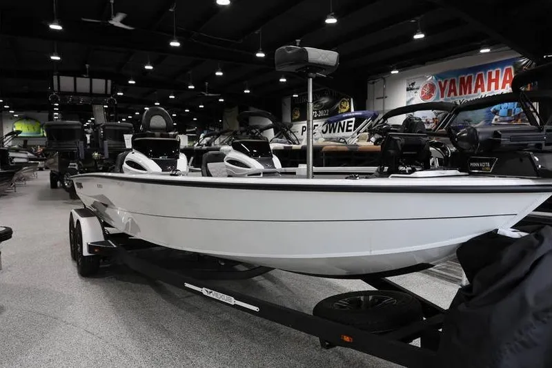 Slide: The Image of 2026 Vexus AVX 2100 boat displayed in showroom with Yamaha signage. - 5