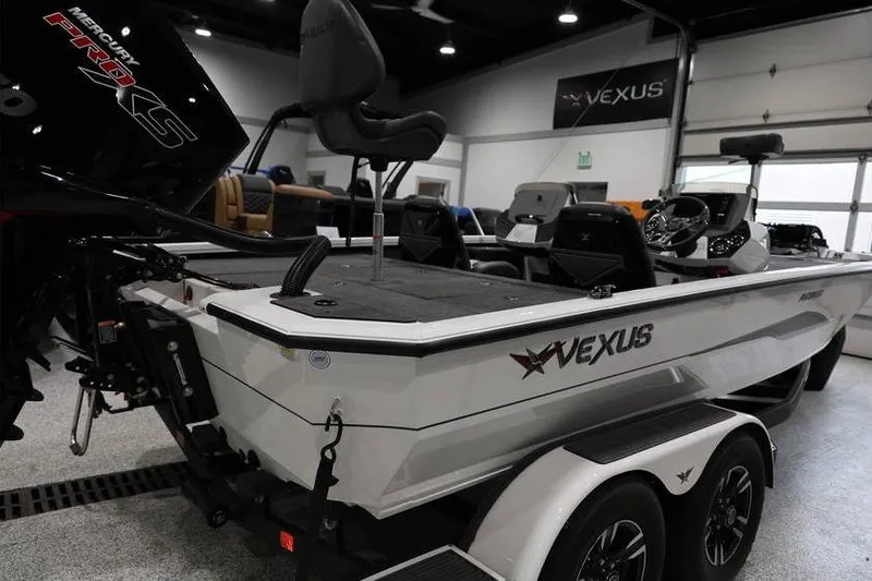 Slide: The Image of 2026 Vexus AVX 2100 boat in showroom, featuring Mercury Pro XS engine. - 7