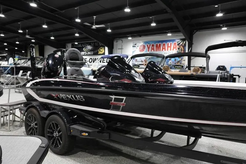 Slide: The Image of 2026 Vexus VXs21 boat displayed indoors, showcasing sleek design and modern features. - 11