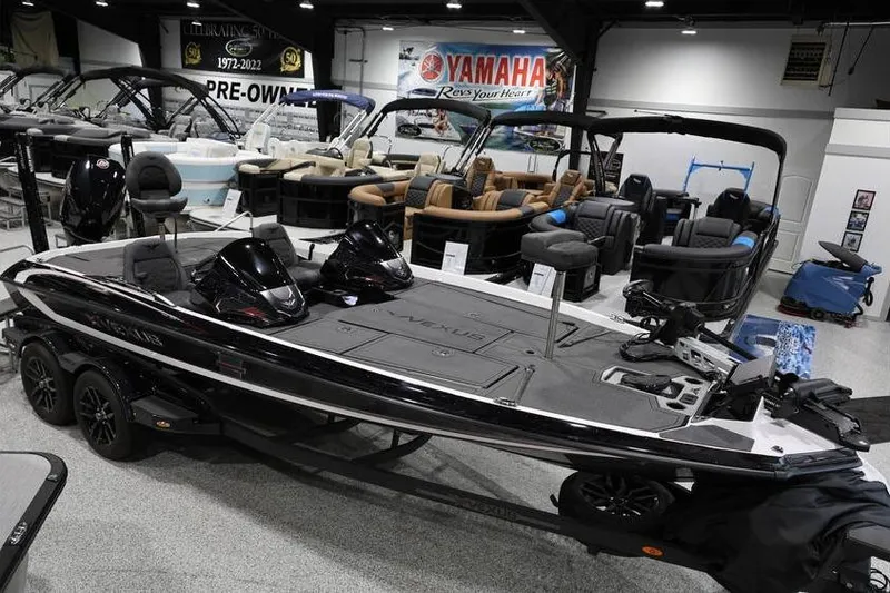 Slide: The Image of 2026 Vexus VXs21 boat displayed in showroom with Yamaha banner in background. - 12
