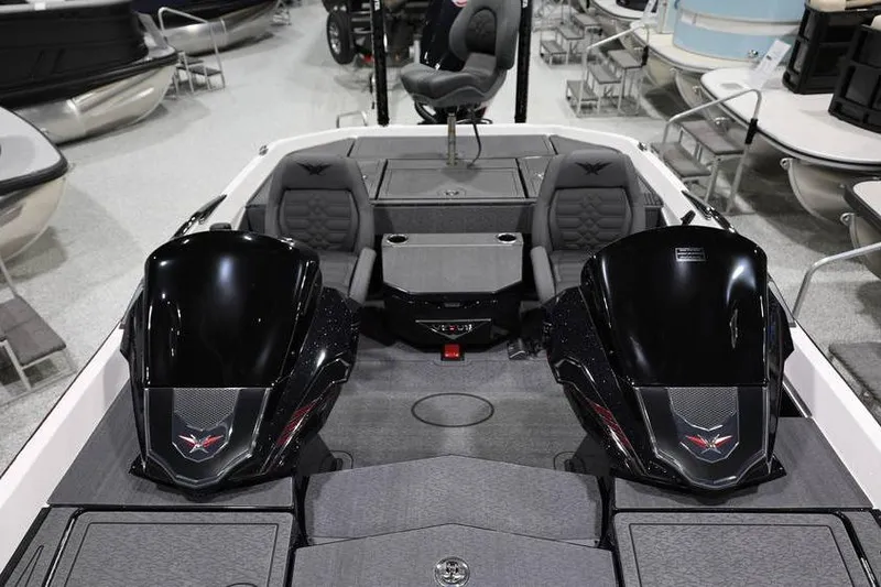 Slide: The Image of 2026 Vexus VXs21 boat interior with dual engines and seating in showroom. - 18