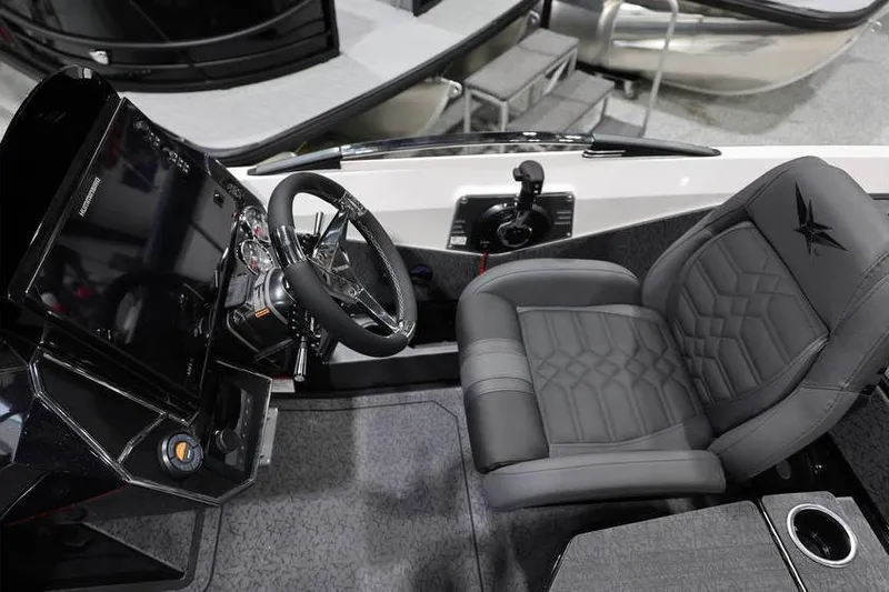 Slide: The Image of 2026 Vexus VXs21 boat cockpit with steering wheel and cushioned seat. - 22