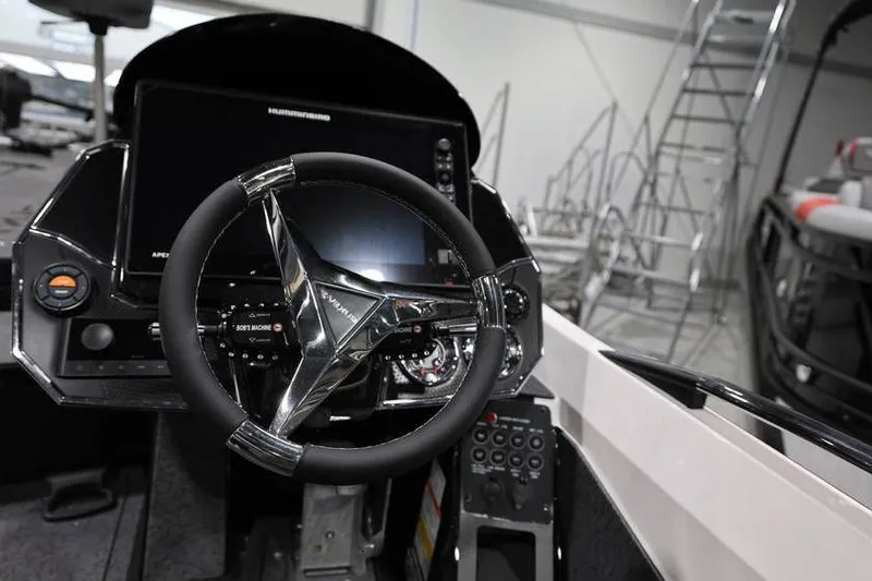 Slide: The Image of 2026 Vexus VXs21 boat dashboard with steering wheel and control panel. - 28