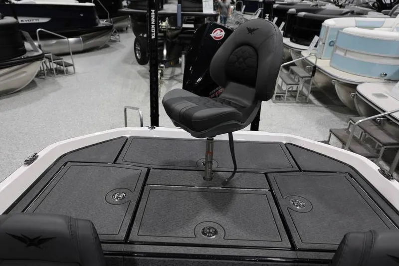 Slide: The Image of 2026 Vexus VXs21 boat interior with swivel seat and storage compartments. - 29