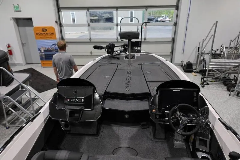 Slide: The Image of 2026 Vexus VXs21 boat interior in showroom with advanced controls and seating. - 31