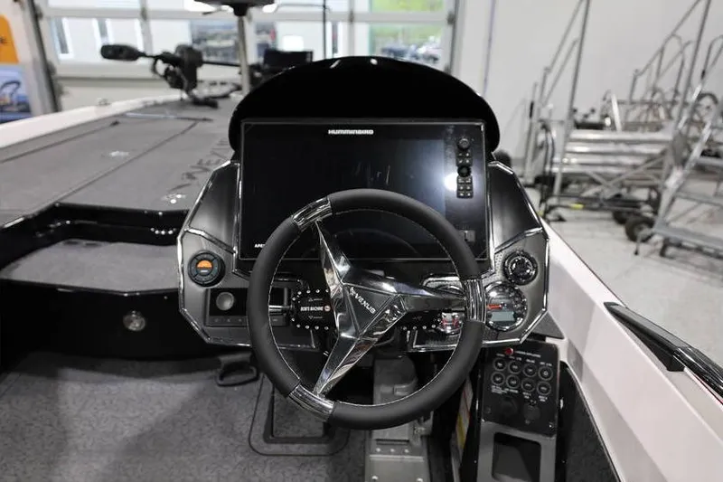 Slide: The Image of 2026 Vexus VXs21 boat dashboard with steering wheel and electronic display. - 32